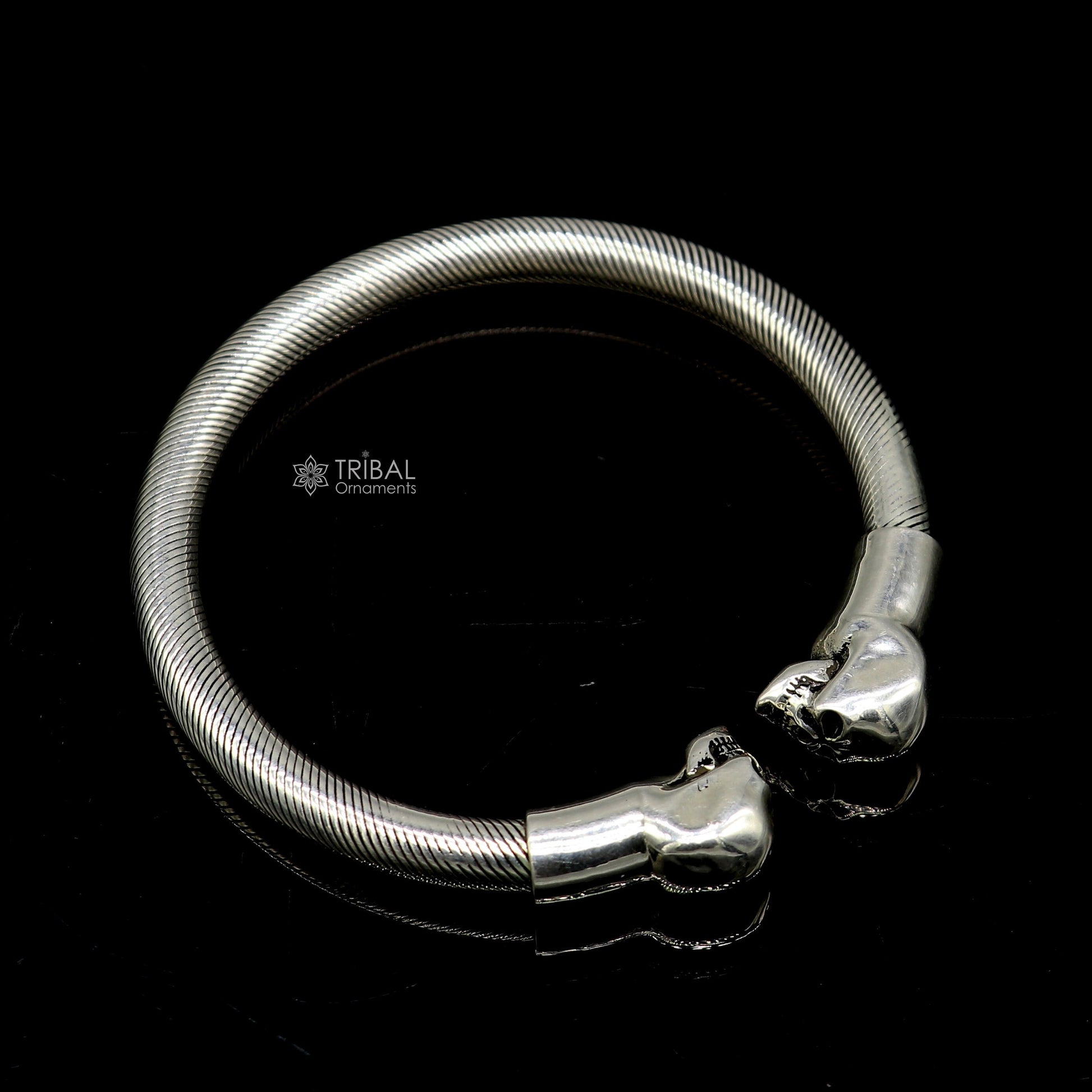 Sterling silver human skull design bangle cuff bracelet for unisex, crafted by Tribal Ornaments, featuring detailed skull artwork.