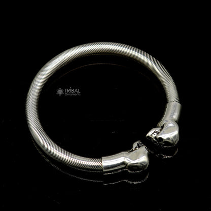 Sterling silver human skull design bangle cuff bracelet for unisex, crafted by Tribal Ornaments, featuring detailed skull artwork.