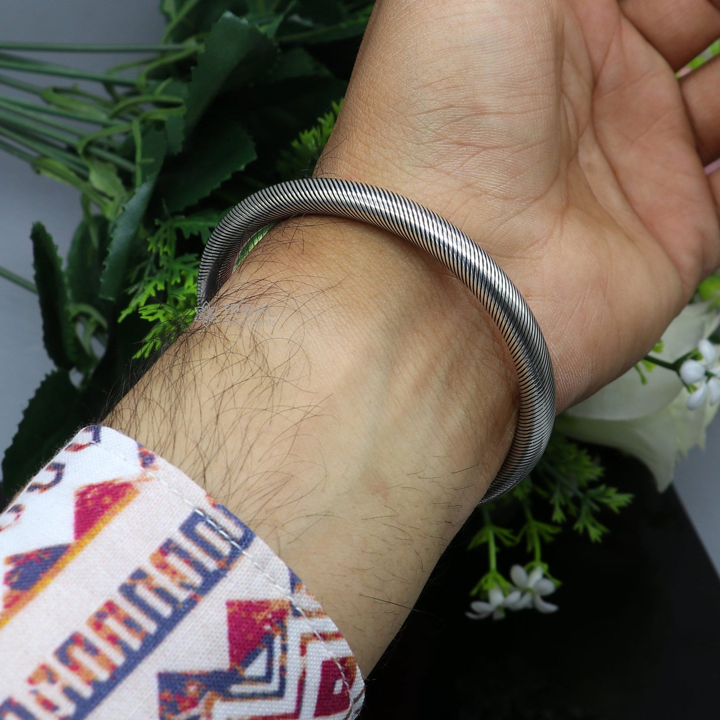 Sterling silver human skull design bangle cuff bracelet for unisex, handmade by Tribal Ornaments, stylish and bold jewelry piece.