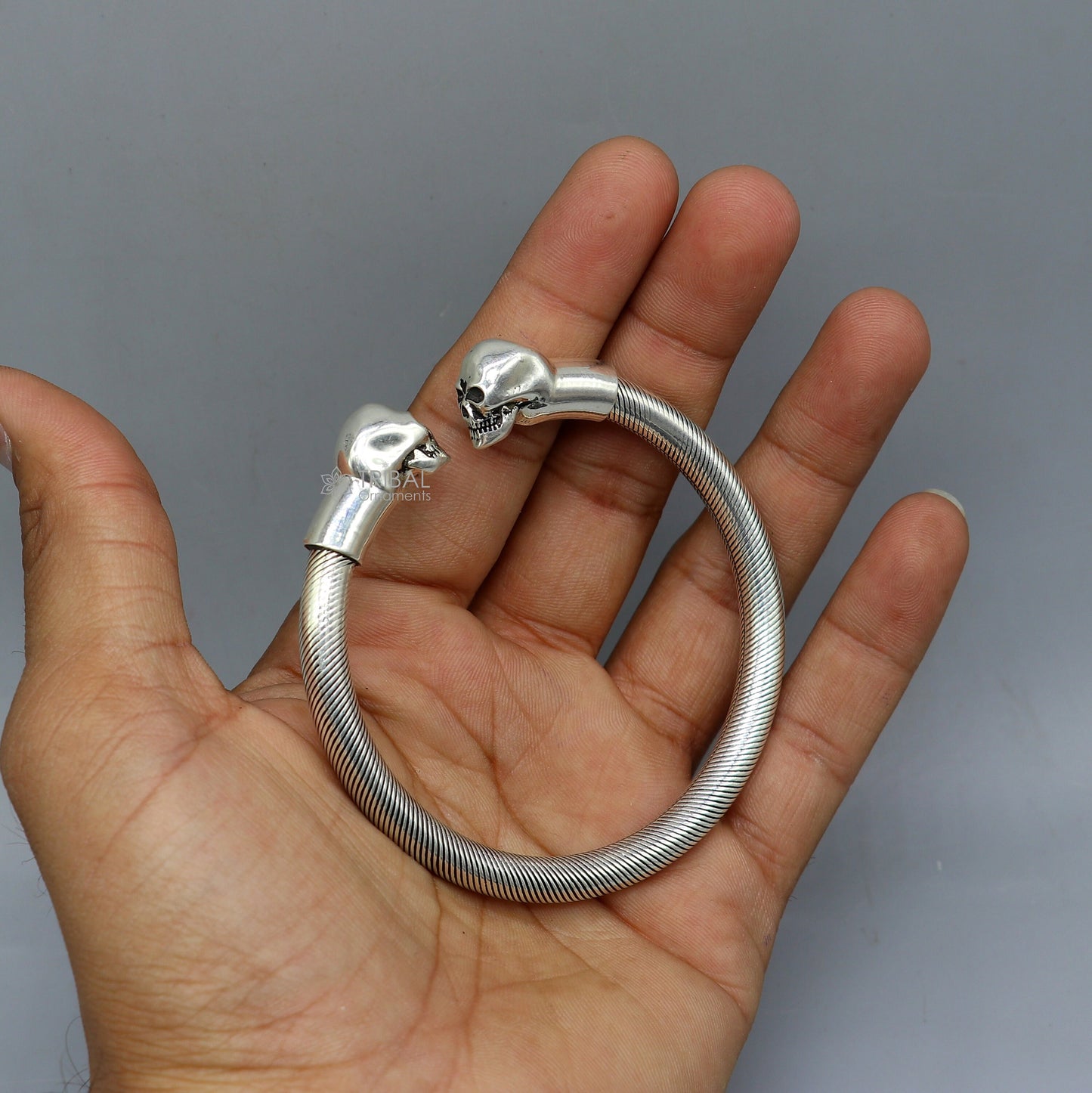 Sterling silver human skull design bangle cuff bracelet for unisex, handcrafted by Tribal Ornaments.
