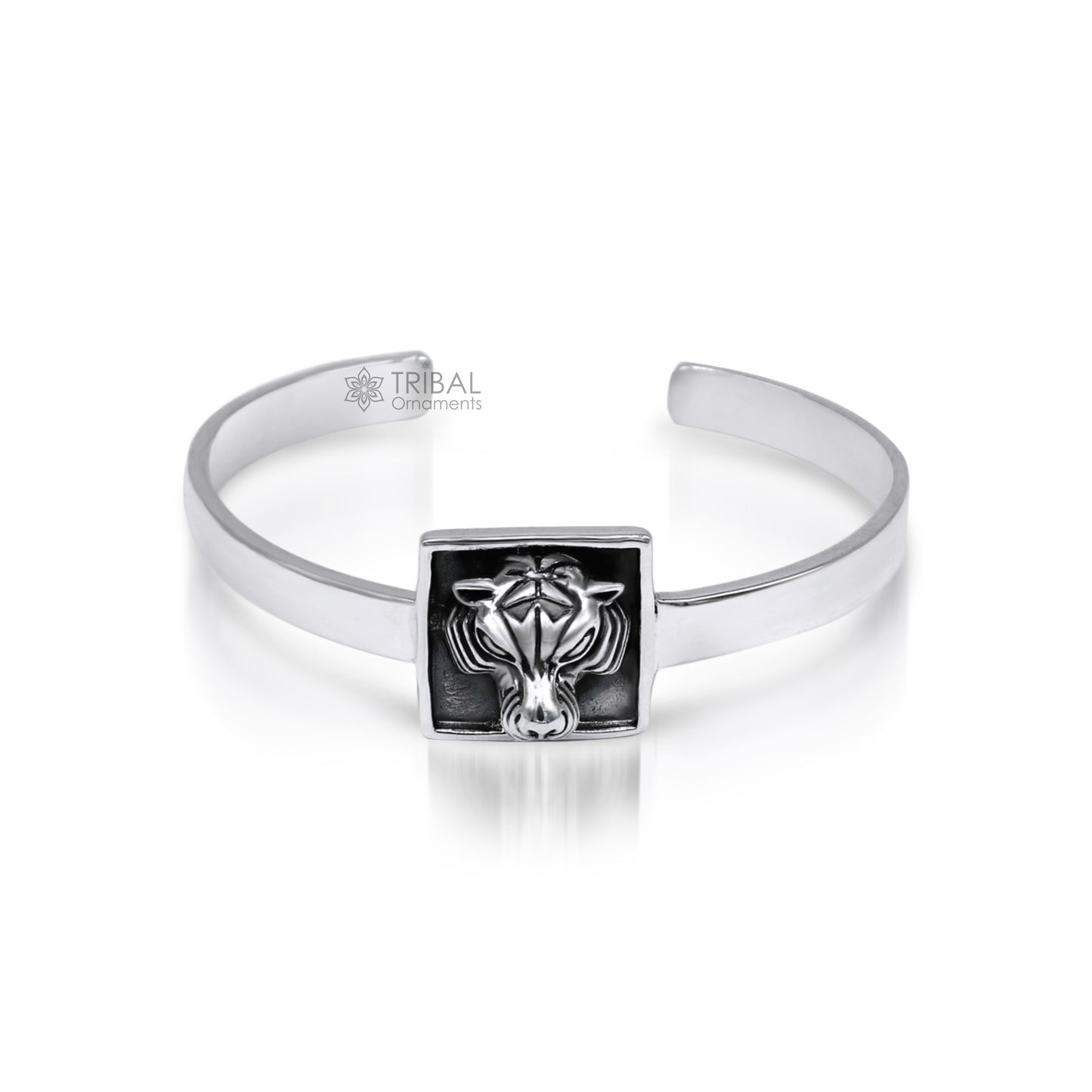 Sterling silver lion face design adjustable bangle cuff bracelet by TRIBAL ORNAMENTS, unisex ethnic jewelry with intricate craftsmanship.