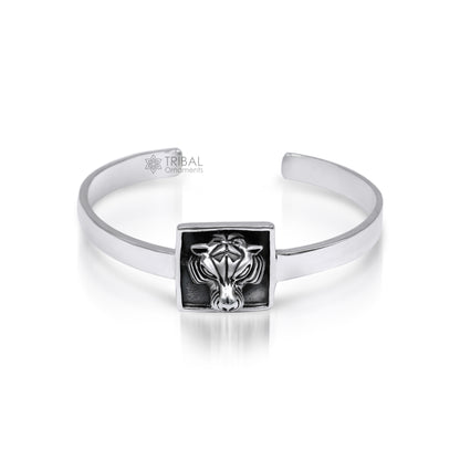 Sterling silver lion face design adjustable bangle cuff bracelet by TRIBAL ORNAMENTS, unisex ethnic jewelry with intricate craftsmanship.