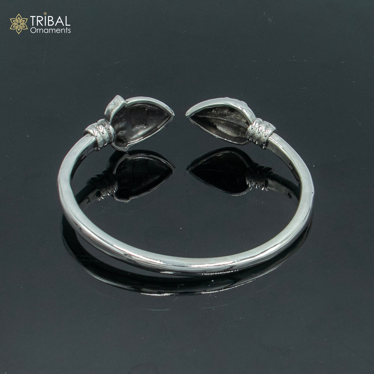Sterling silver Lord Karthikeya design bangle cuff bracelet by TRIBAL ORNAMENTS, adjustable unisex jewelry with intricate detailing.
