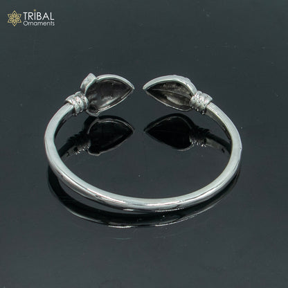 Sterling silver Lord Karthikeya design bangle cuff bracelet by TRIBAL ORNAMENTS, adjustable unisex jewelry with intricate detailing.
