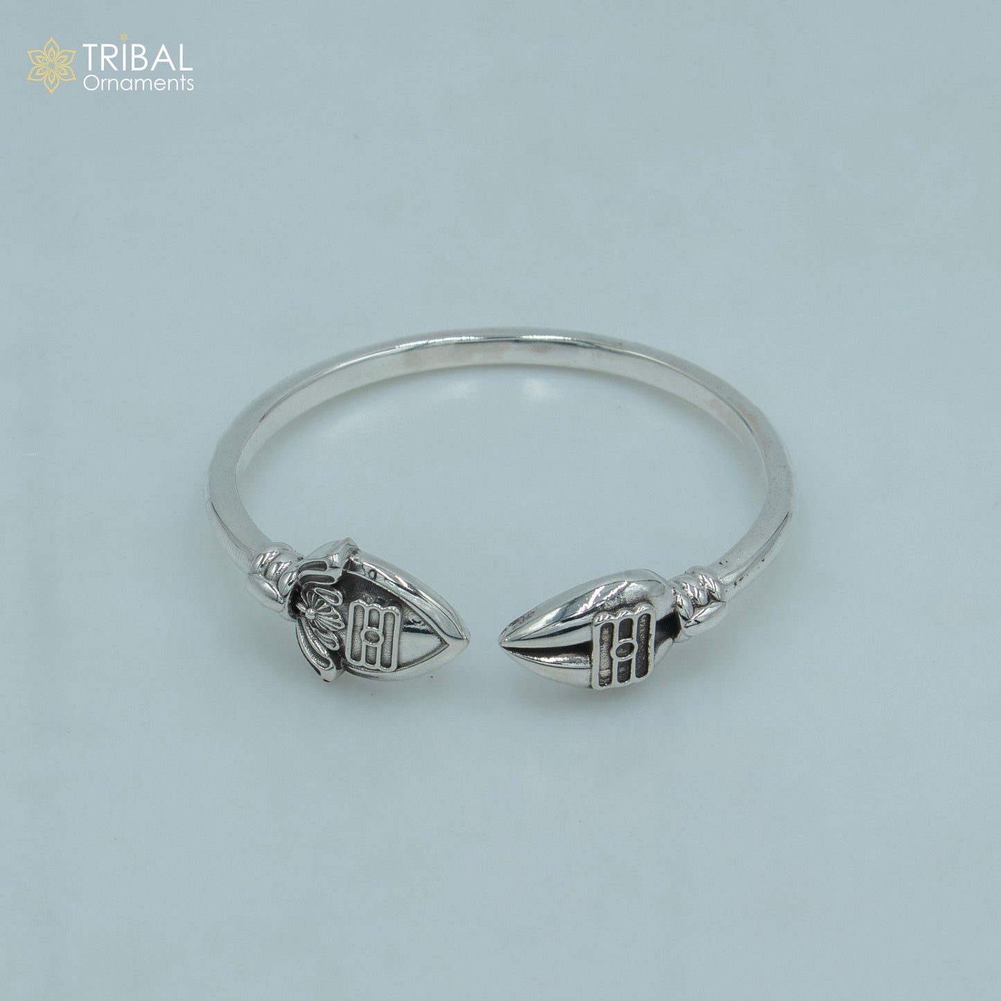 Sterling silver Lord Karthikeya design bangle cuff bracelet by Tribal Ornaments, adjustable unisex jewelry with intricate craftsmanship.