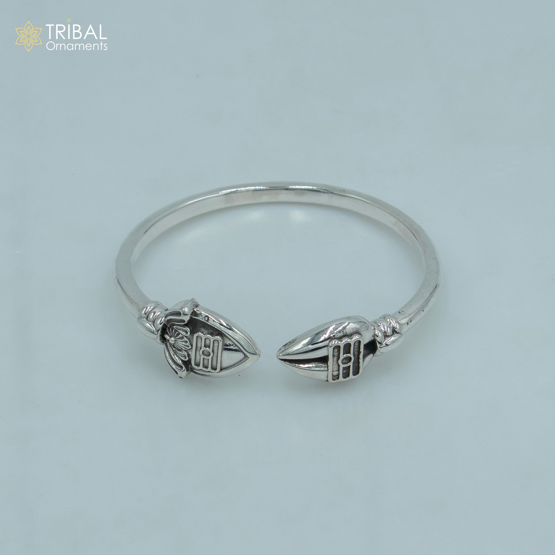 Sterling silver Lord Karthikeya design bangle cuff bracelet by Tribal Ornaments, adjustable unisex jewelry with intricate craftsmanship.