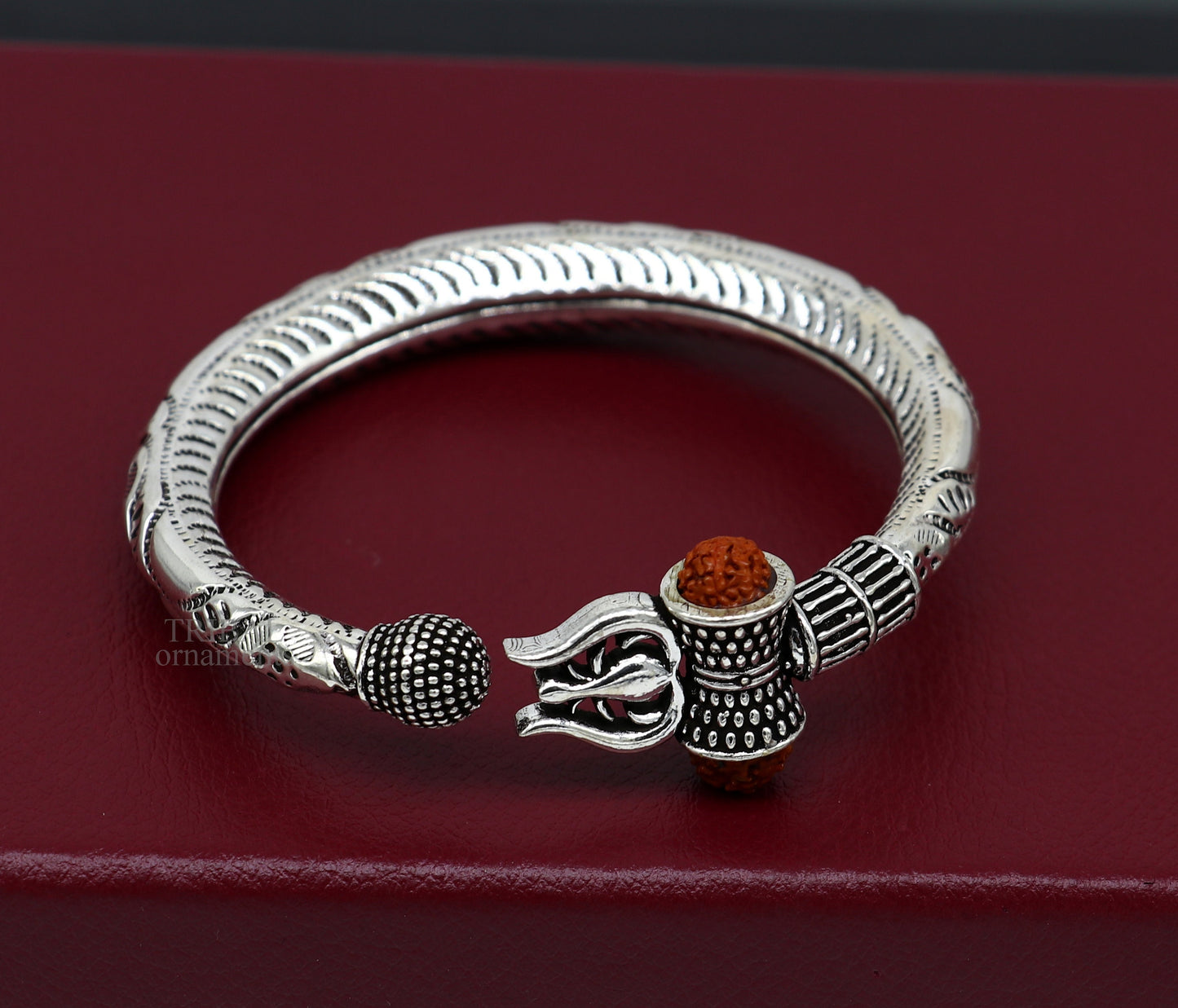 Sterling silver Lord Shiva trident bracelet with Rudraksha beads, handmade tribal ornament, Mahadeva-inspired jewelry.
