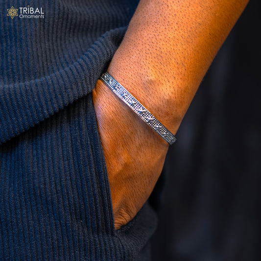Sterling silver open face cuff bracelet by Tribal Ornaments, handmade adjustable jewelry with intricate tribal design.