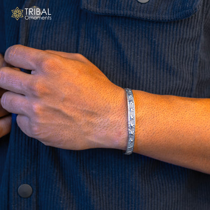 Sterling silver open face cuff bracelet by Tribal Ornaments, handcrafted adjustable bangle jewelry with intricate tribal design.
