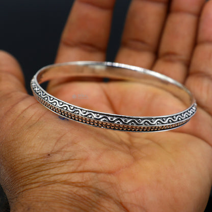 Handmade 925 sterling silver Punjabi shikha and kada bracelet by TRIBAL ORNAMENTS, featuring delicate, designer jewelry for men and women.