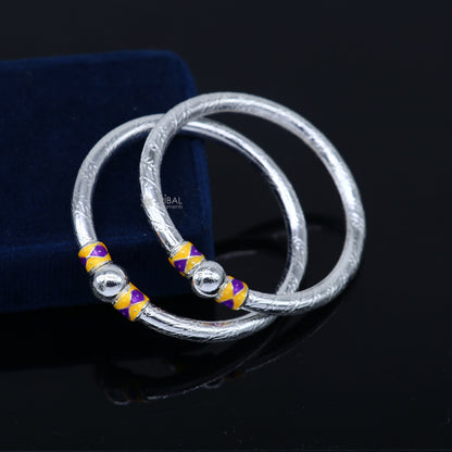 Sterling silver baby bangle bracelet with single ball design, handmade by Tribal Ornaments, showcasing elegant and durable baby jewelry.