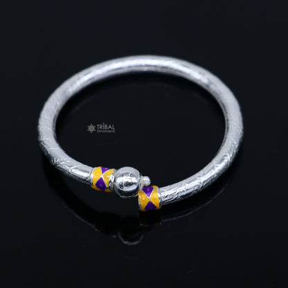 Sterling silver baby bangle bracelet with single ball design, handmade tribal jewelry for infants and toddlers.