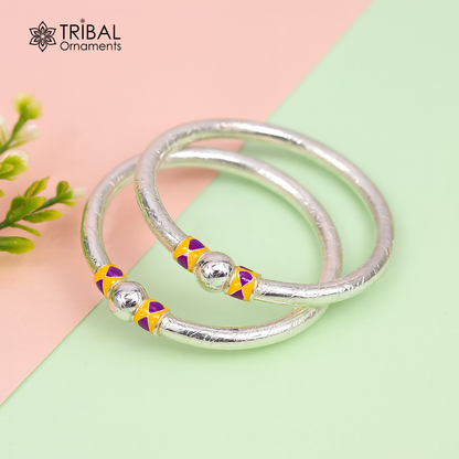 Sterling silver baby bangle bracelet with single ball design by Tribal Ornaments, showcasing handmade silver baby jewelry.