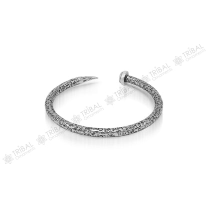 Sterling silver handmade adjustable cuff bracelet with printed text, unisex design, tribal ornament style jewelry.