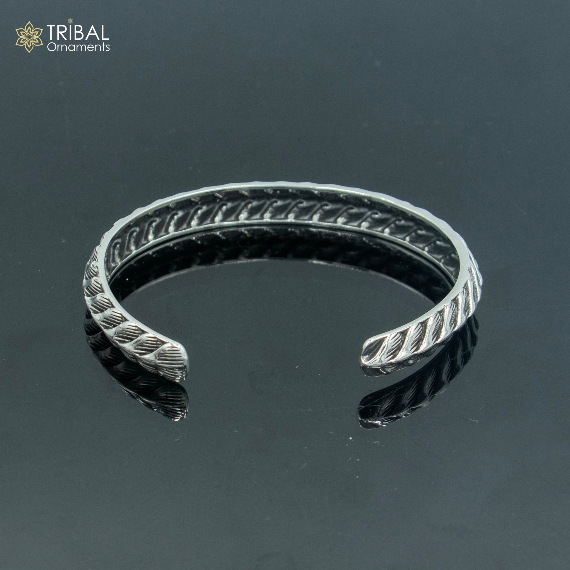 Sterling silver handmade unisex adjustable bangle bracelet by Tribal Ornaments with stylish cuff design.