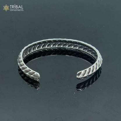 Sterling silver handmade unisex adjustable bangle bracelet by Tribal Ornaments with stylish cuff design.
