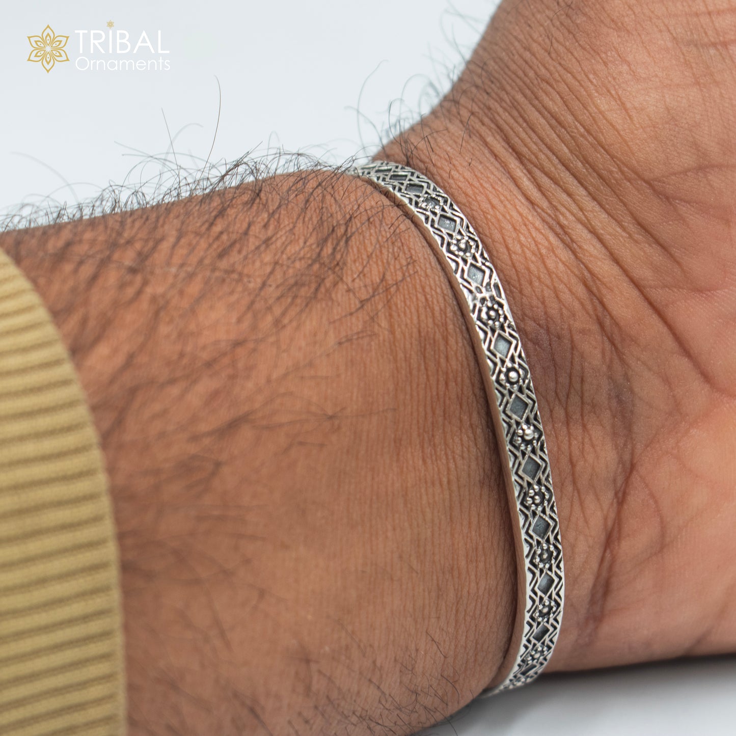 Sterling silver stylish adjustable bangle cuff bracelet by TRIBAL ORNAMENTS, unisex jewelry with intricate handcrafted design.