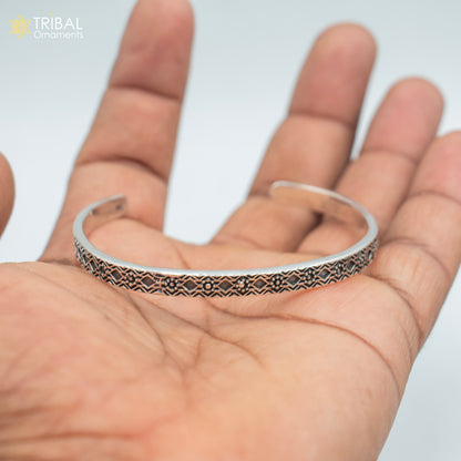Sterling silver adjustable bangle cuff bracelet by TRIBAL ORNAMENTS, unisex stylish handmade jewelry with intricate design.