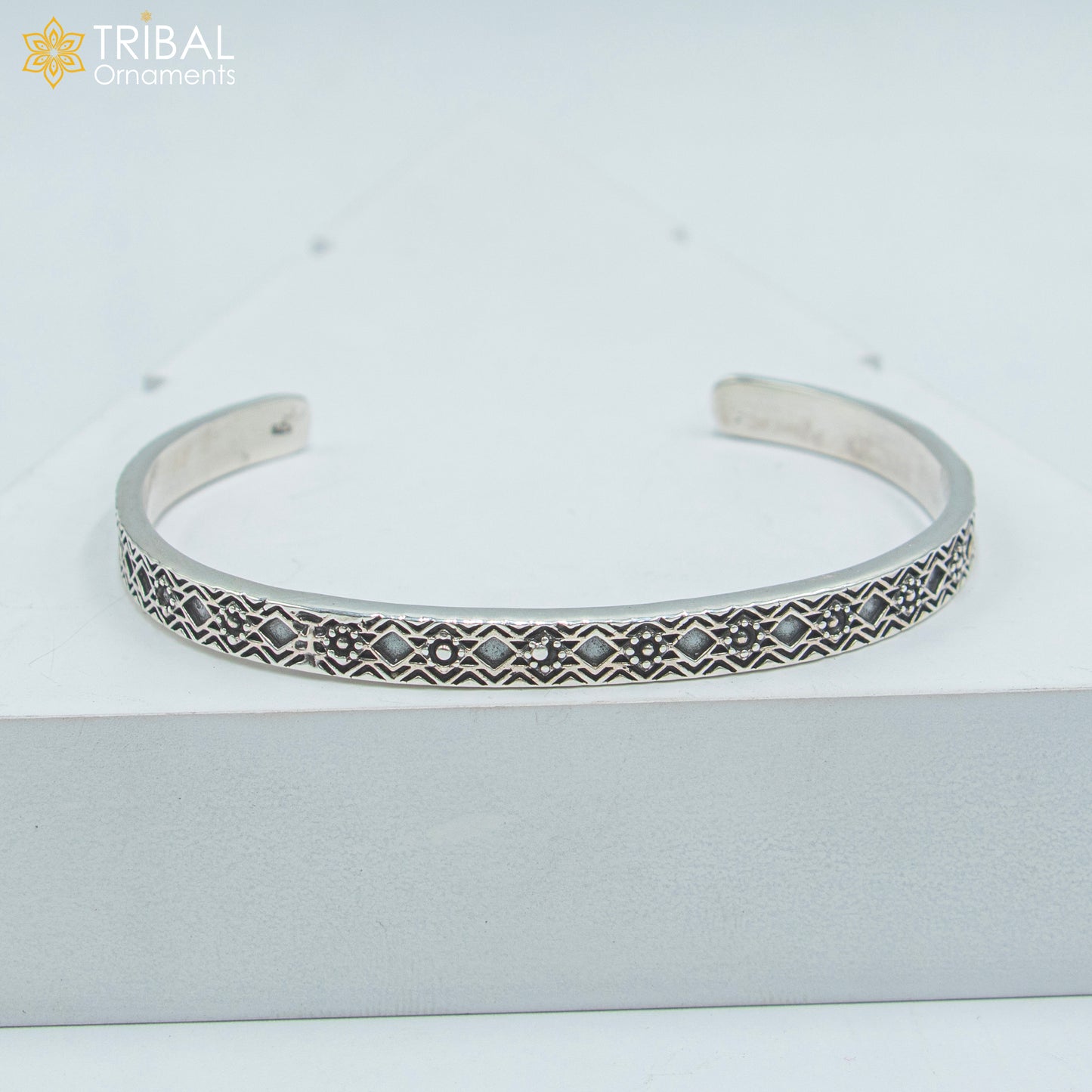 Sterling silver adjustable bangle cuff bracelet by TRIBAL ORNAMENTS, unisex handmade jewelry with stylish design.