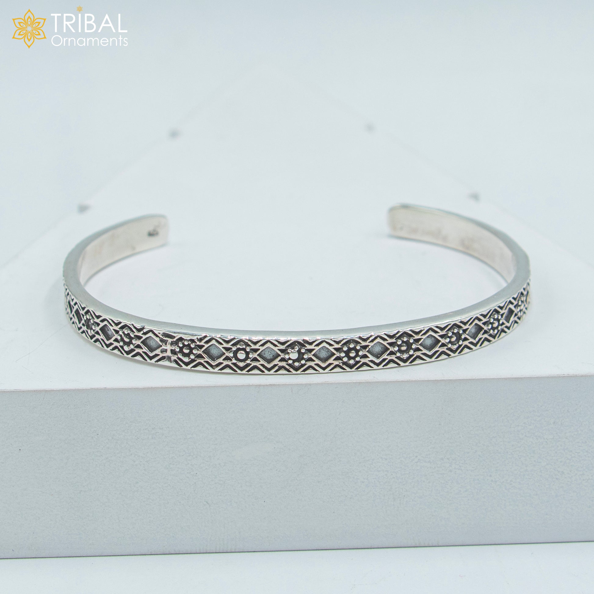 Sterling silver adjustable bangle cuff bracelet by TRIBAL ORNAMENTS, unisex handmade jewelry with stylish design.