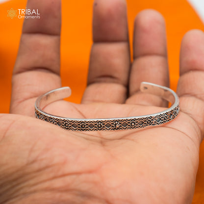 Stylish adjustable 925 sterling silver bangle cuff bracelet by TRIBAL ORNAMENTS, unisex jewelry with intricate handcrafted design.