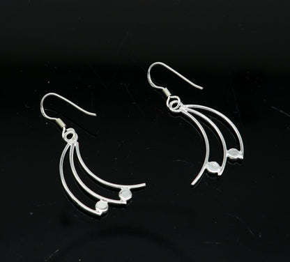 Sterling silver handmade geometric hoop earring with dainty drop design, elegant and trendy jewelry by Tribal Ornaments.