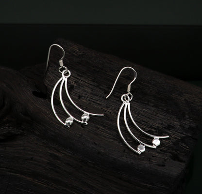 Sterling silver handmade geometric hoop earring with dainty drop dangle design by TRIBAL ORNAMENTS.