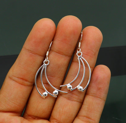 Sterling silver handmade hoop earring with geometric dangle design from Tribal Ornaments, elegant and trendy jewelry for her.