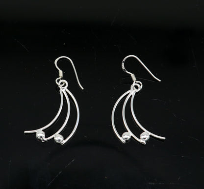 Sterling silver handmade geometric hoop earring with drop dangle design, elegant and trendy jewelry by TRIBAL ORNAMENTS.