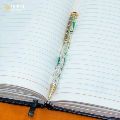 925 Sterling silver handmade peacock design ball pen by TRIBAL ORNAMENTS, featuring intricate silver craftsmanship.
