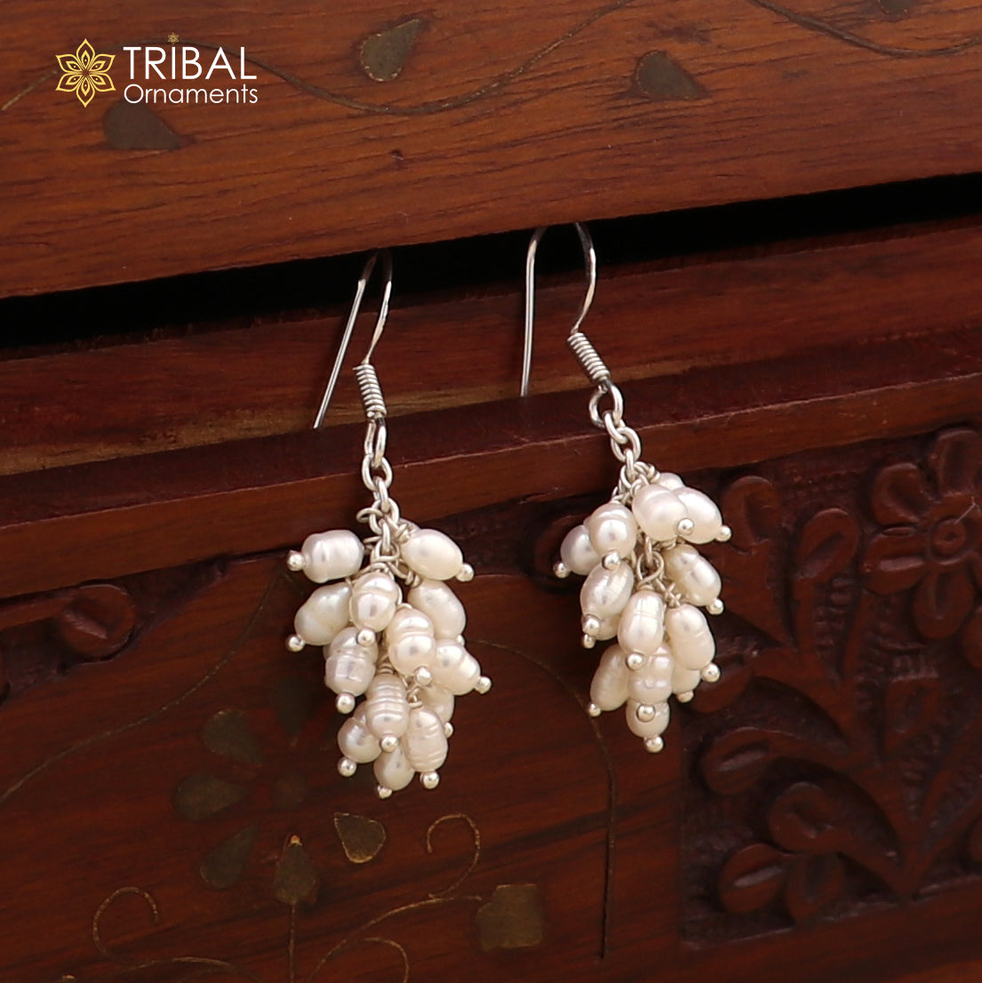 Sterling silver hoops earrings with elegant pearls, by TRIBAL ORNAMENTS, showcasing a stylish and sophisticated jewelry design.