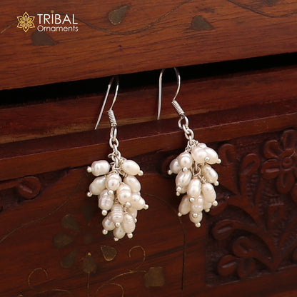 Sterling silver hoops earrings with elegant pearls, by TRIBAL ORNAMENTS, showcasing a stylish and sophisticated jewelry design.
