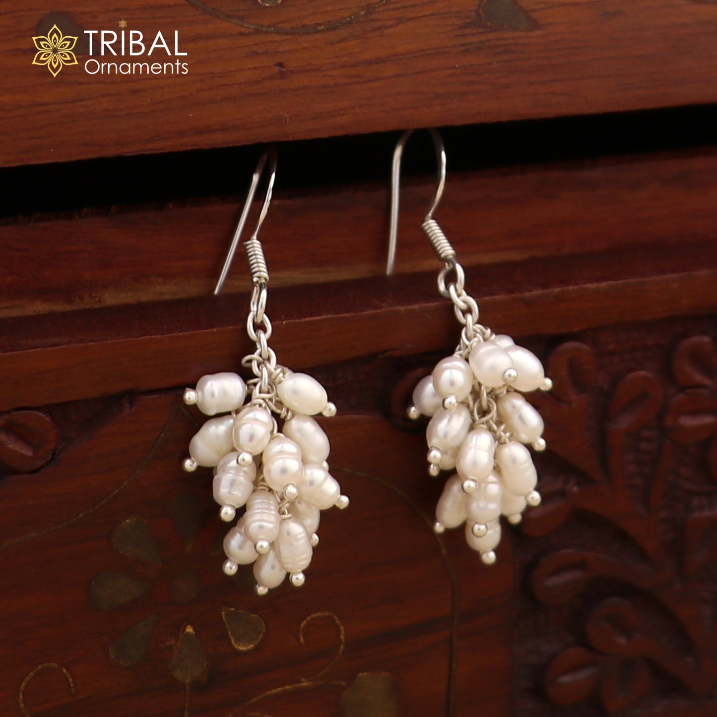 Sterling silver hoops earrings with elegant pearl accents, crafted by Tribal Ornaments, showcasing a sophisticated jewelry design.