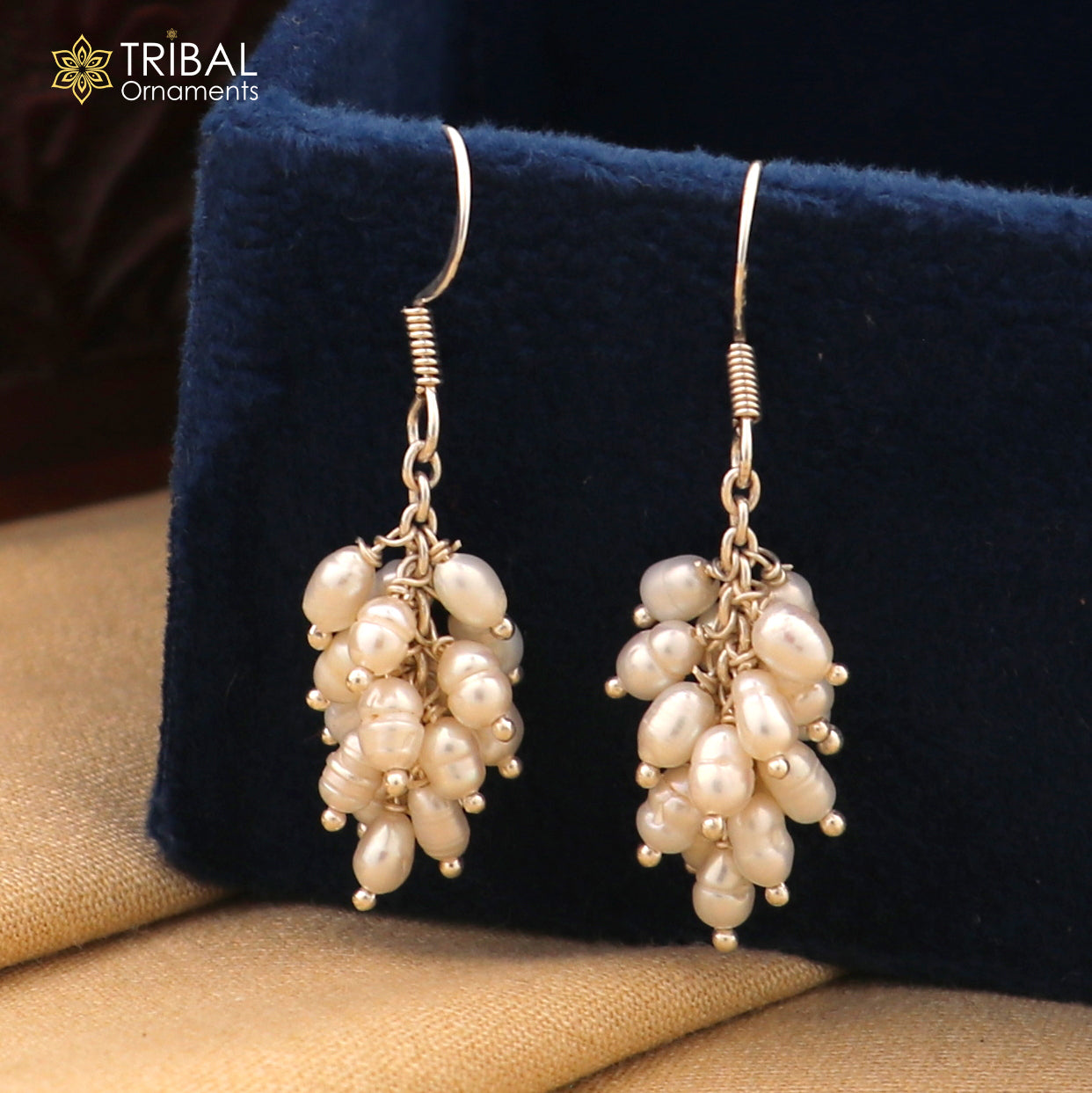 Sterling silver hoops earrings with elegant pearls from TRIBAL ORNAMENTS, showcasing a stylish and sophisticated jewelry design.
