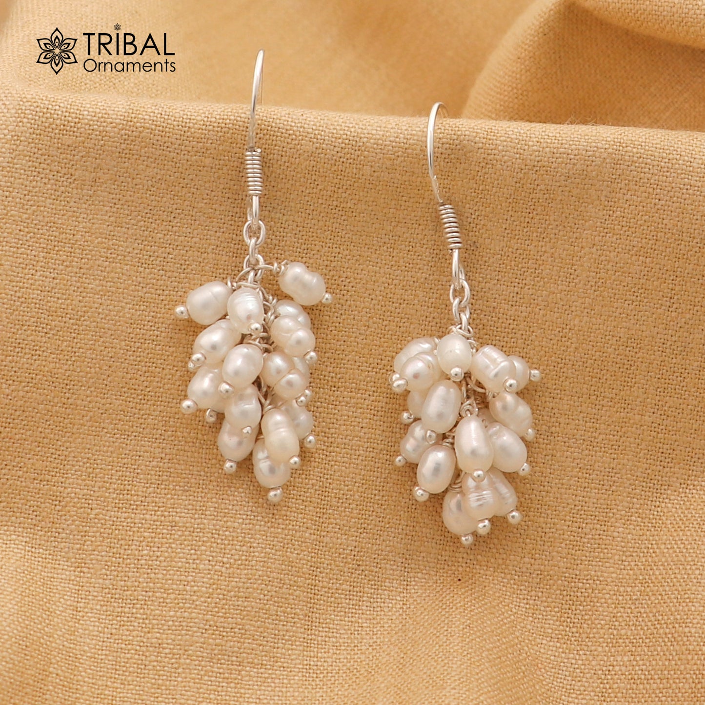 Sterling silver hoops earring with a beautiful pearl from Tribal Ornaments, showcasing elegant jewelry design.