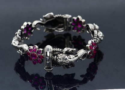 925 sterling silver Ganesha design bangle bracelet with floral red stone accents, ethnic jewelry by TRIBAL ORNAMENTS.