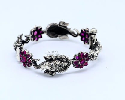925 sterling silver Ganesha design bangle bracelet with floral red stone accents, ethnic jewelry by TRIBAL ORNAMENTS.