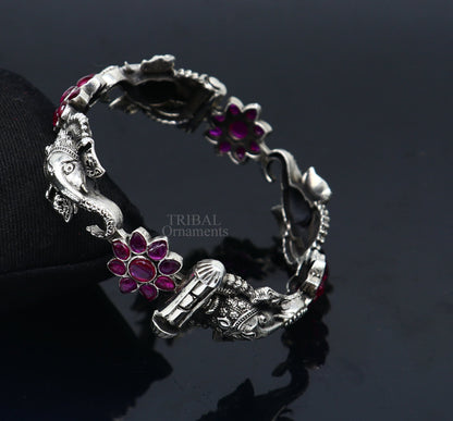 925 sterling silver Ganesha design bangle bracelet with floral red stones, ethnic jewelry by Tribal Ornaments.