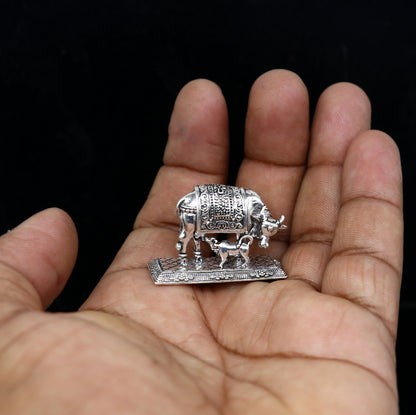 925 sterling silver Kamdhenu cow figurine by Tribal Ornaments, symbolizing wealth and prosperity, with detailed deity design.