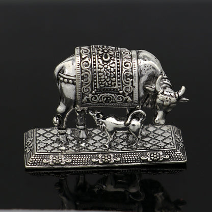 925 sterling silver Kamdhenu cow figurine from Tribal Ornaments, depicting the deity's cow for wealth and prosperity worship.
