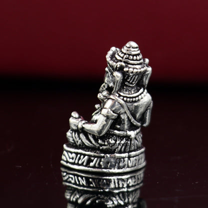 Small handcrafted 925 sterling silver Lord Ganesh idol statue, traditional sculpture for Diwali puja and spiritual gift.