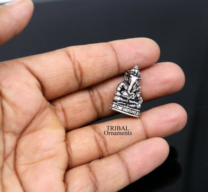 Small handcrafted 925 Sterling silver Lord Ganesh idol statue, detailed figurine for Diwali puja and spiritual decor.