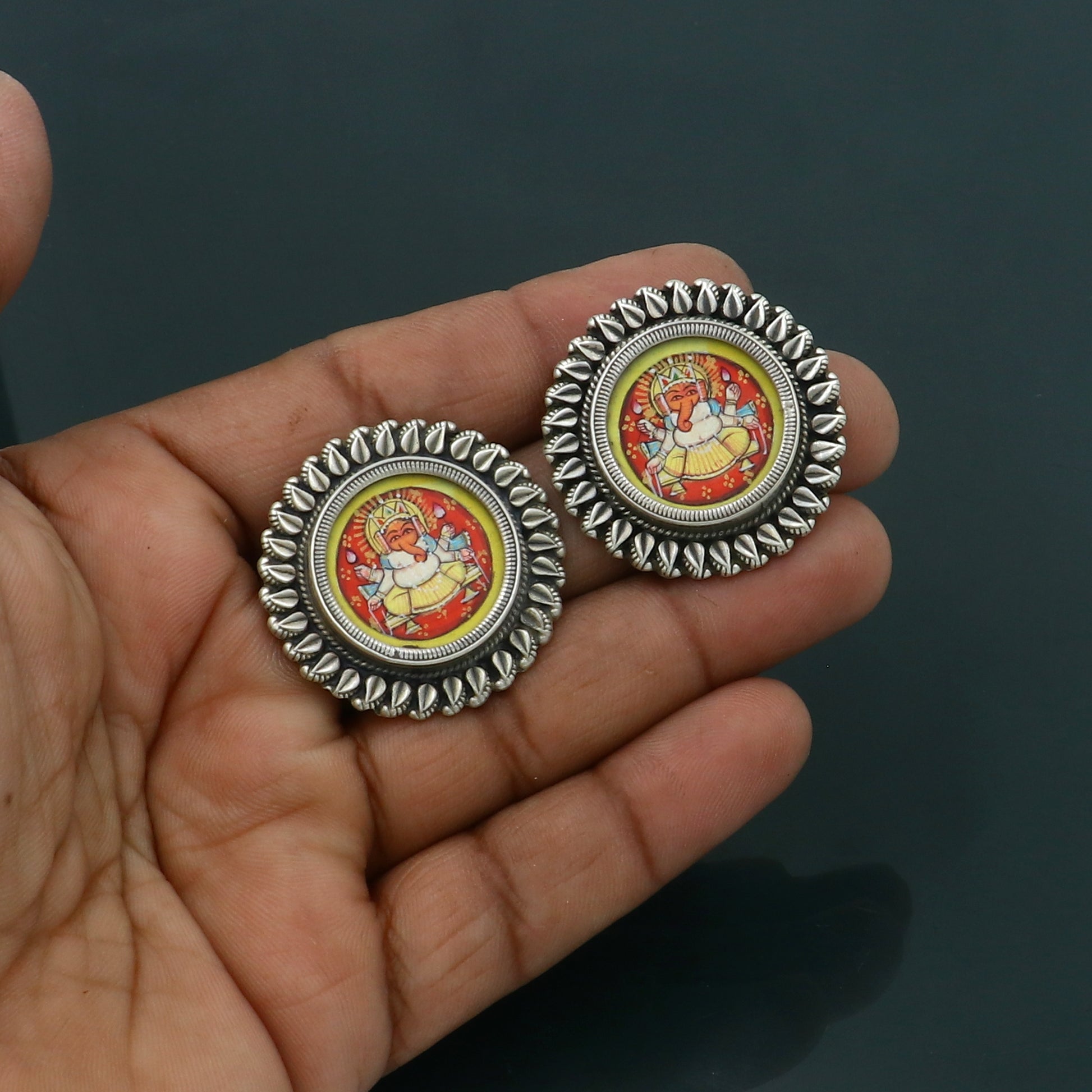 Sterling silver Lord Ganesha miniature painting earrings by Tribal Ornaments featuring detailed Ganesha artwork on hoops.