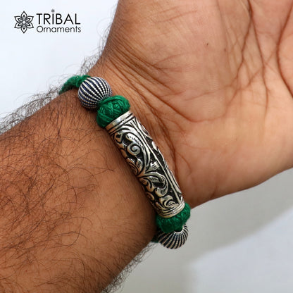 925 sterling silver modern charm bracelet with intricate tribal design, adjustable for brides or ethnic wedding jewelry.