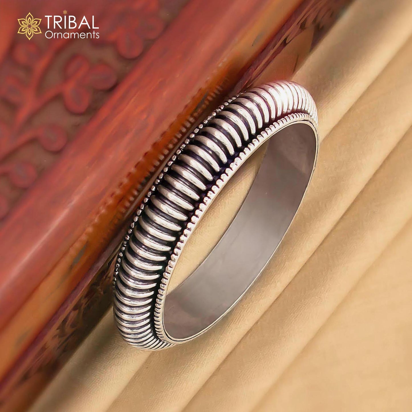 Sterling silver tribal bangle bracelet with modern design, unisex cultural jewelry, personalized and trendy tribal ornament.
