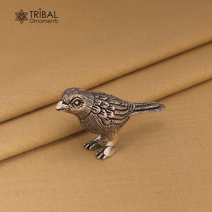 925 sterling silver parrot sculpture by TRIBAL ORNAMENTS, detailed bird figurine for home decor and art display.