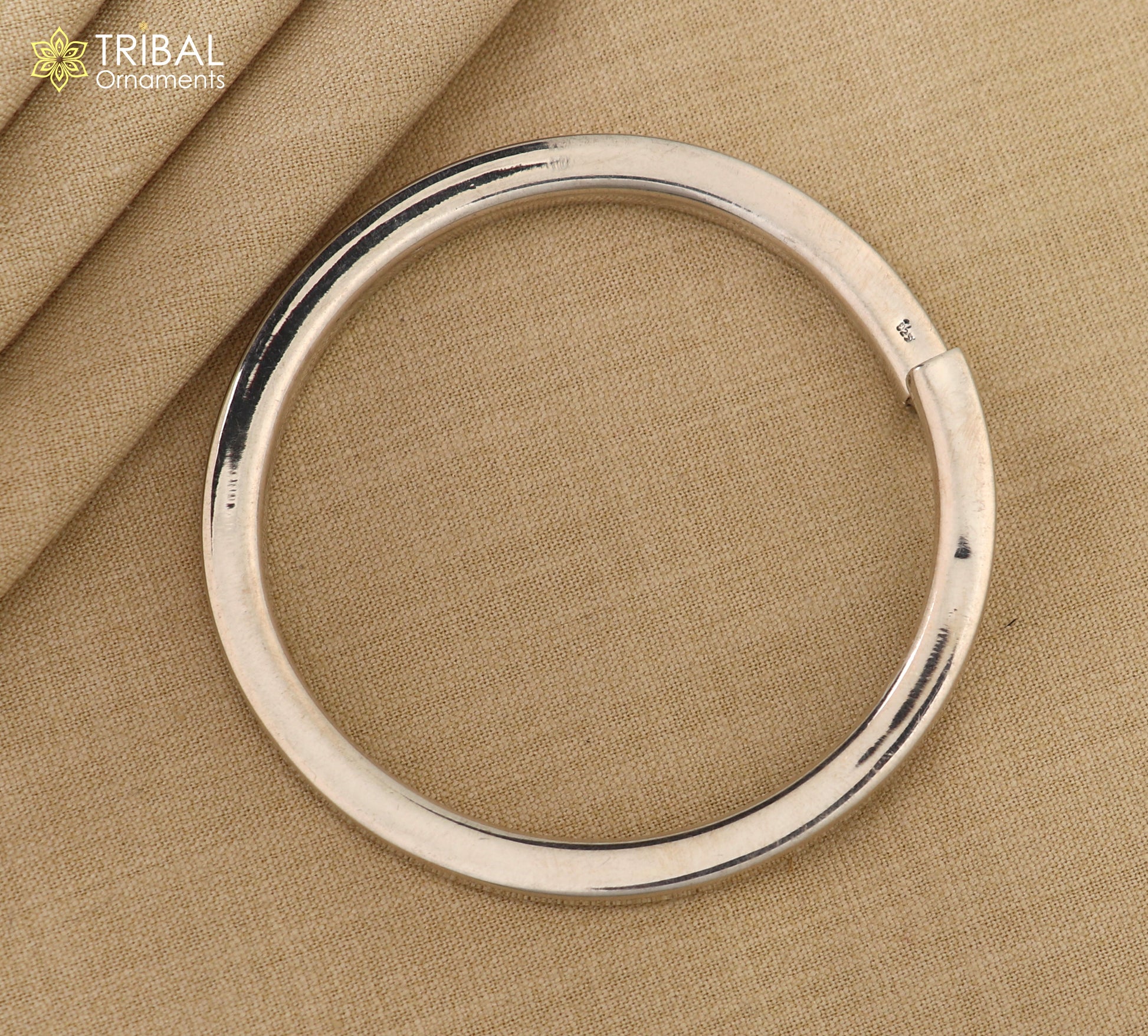 Unisex 925 Sterling silver plain bangle bracelet with a smooth tribal-inspired design by TRIBAL ORNAMENTS.