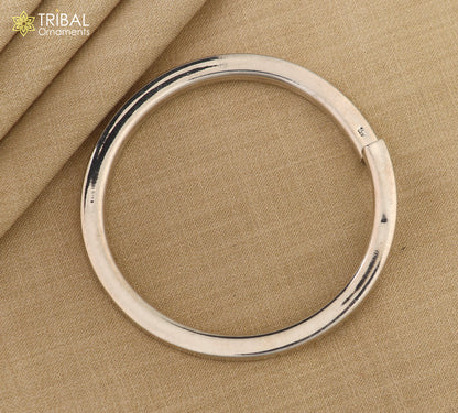 Unisex 925 Sterling silver plain bangle bracelet with a smooth tribal-inspired design by TRIBAL ORNAMENTS.
