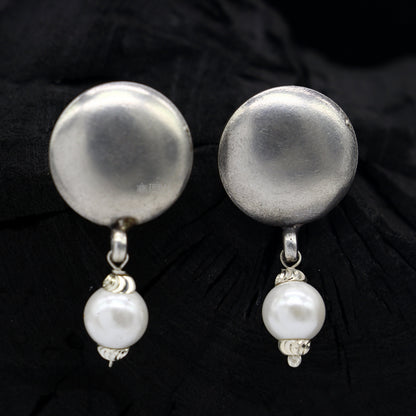 925 sterling silver handmade round stud earrings with tribal design from Rajasthan India, featuring a plain, elegant style.