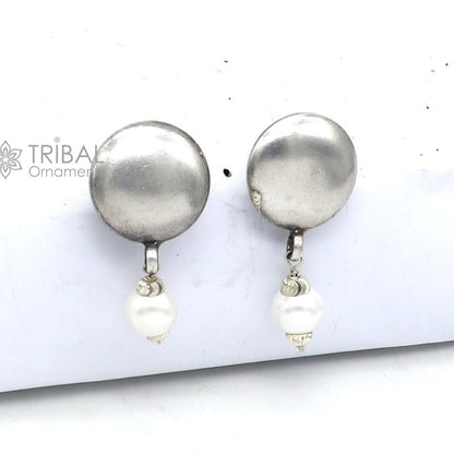 925 sterling silver handmade round stud earrings featuring tribal design from Rajasthan India, crafted by TRIBAL ORNAMENTS.
